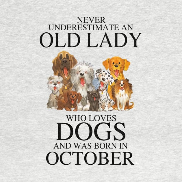 Never Underestimate An Old Lady Who Loves Dogs And Was Born In October by louismcfarland